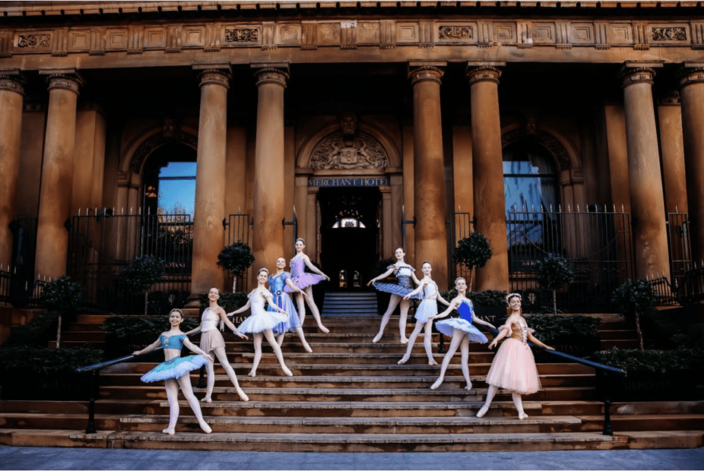 The nine HPYB dancers who competed at YGP Paris in Nov 2023 in their handmade classical costumes at The Merchant Hotel in Belfast (from L to R): Leah McNally, Lucy Dunbar, Georgia Crawford, Kristina Murphy, Tess French, Zara Crawford, Madison Crawford, Aoife Finnieston, Amelia Larmour. Photo by Sofia De Vasconcelos of Khali and Me Photography.